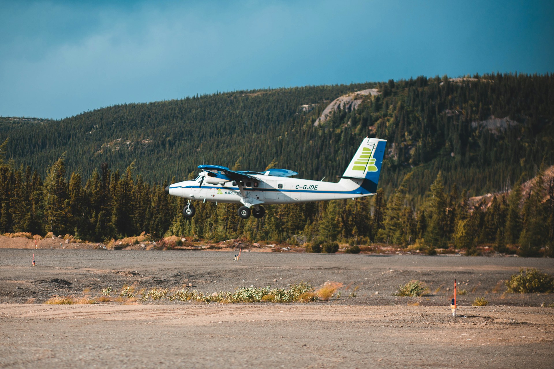 Charter plane taking off from a remote airstrip